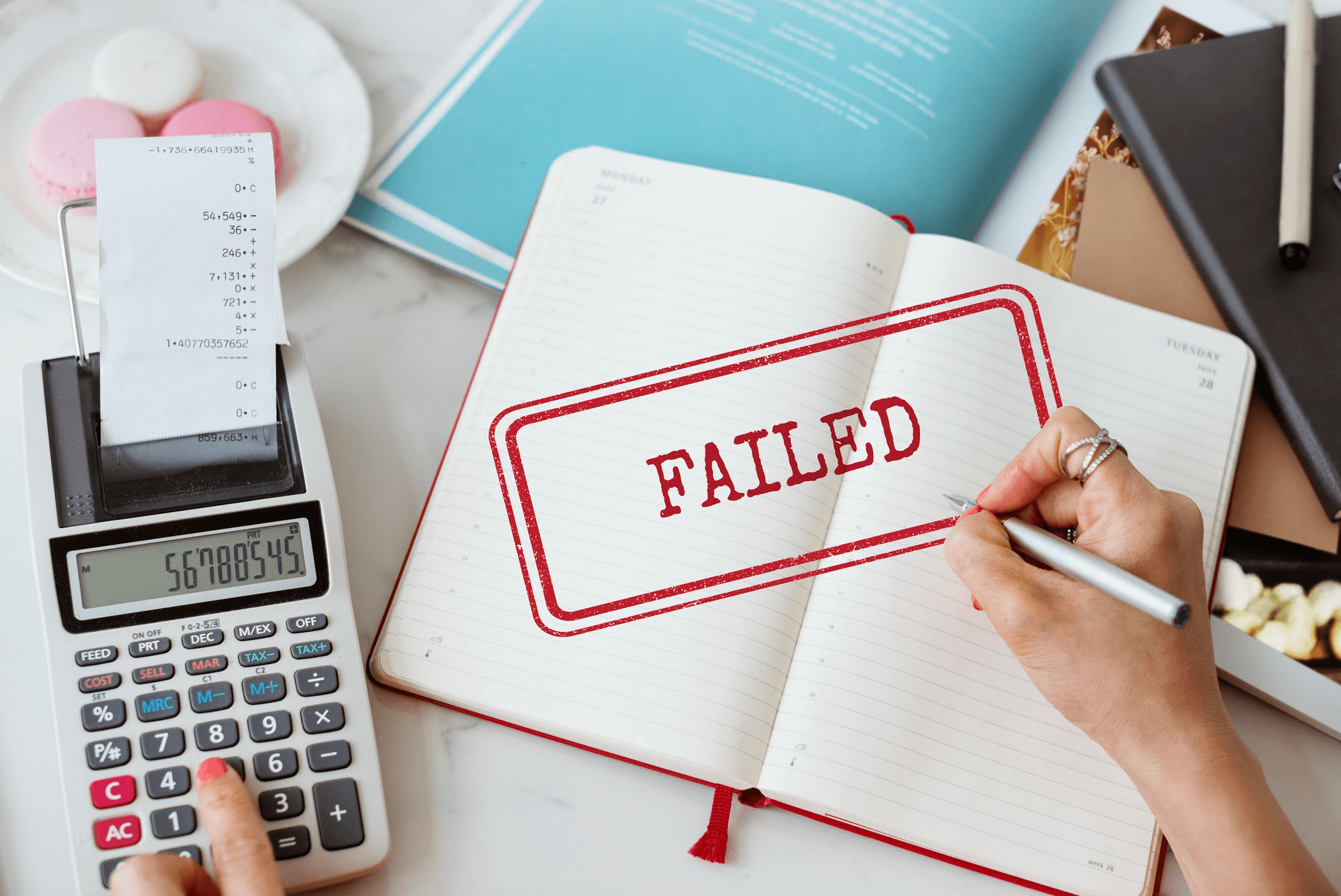 Insurance claim failed message with calculator and documents.