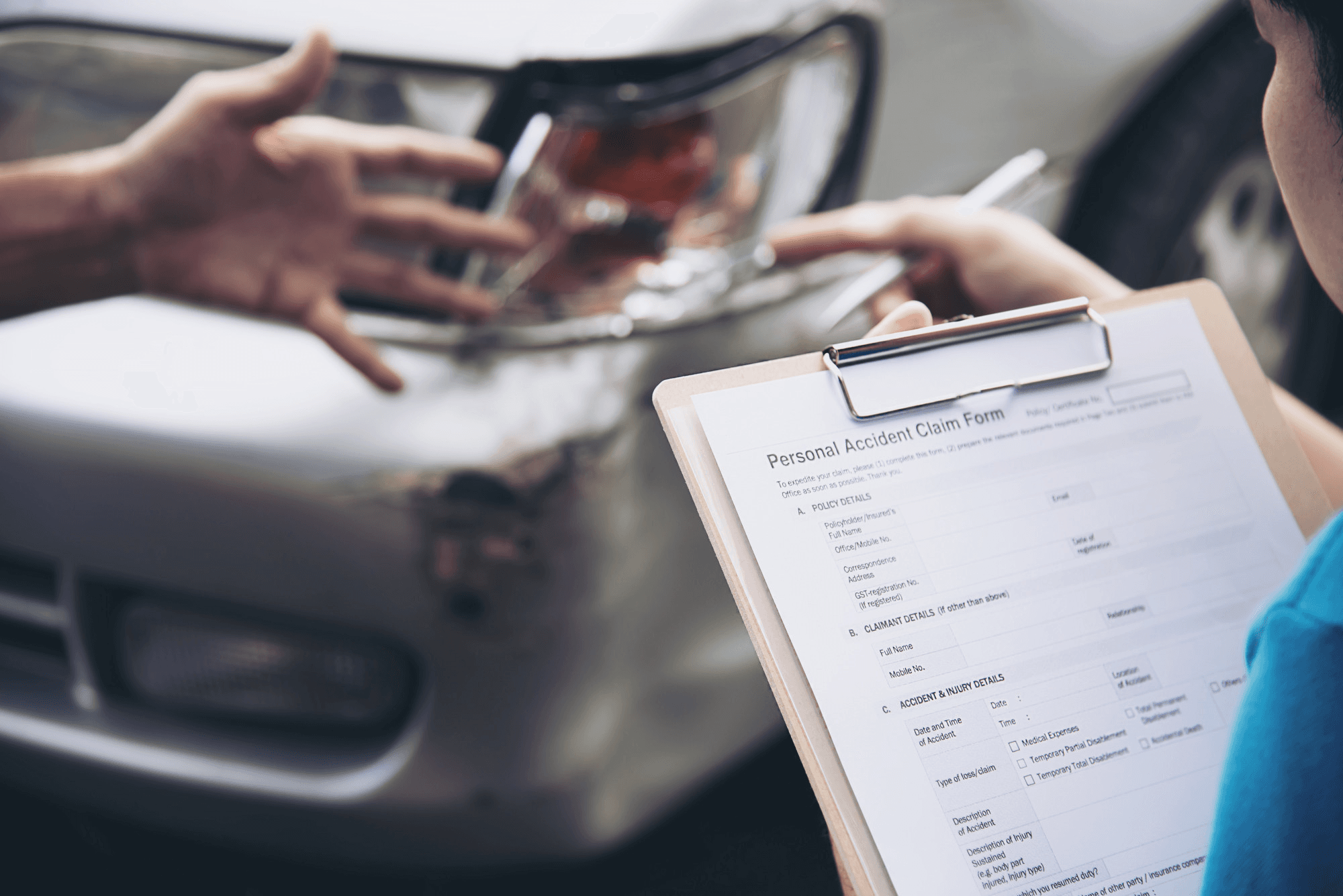 Woman filling personal accident insurance claim form.