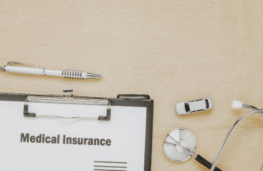 Medical insurance with a stethoscope written on paper.