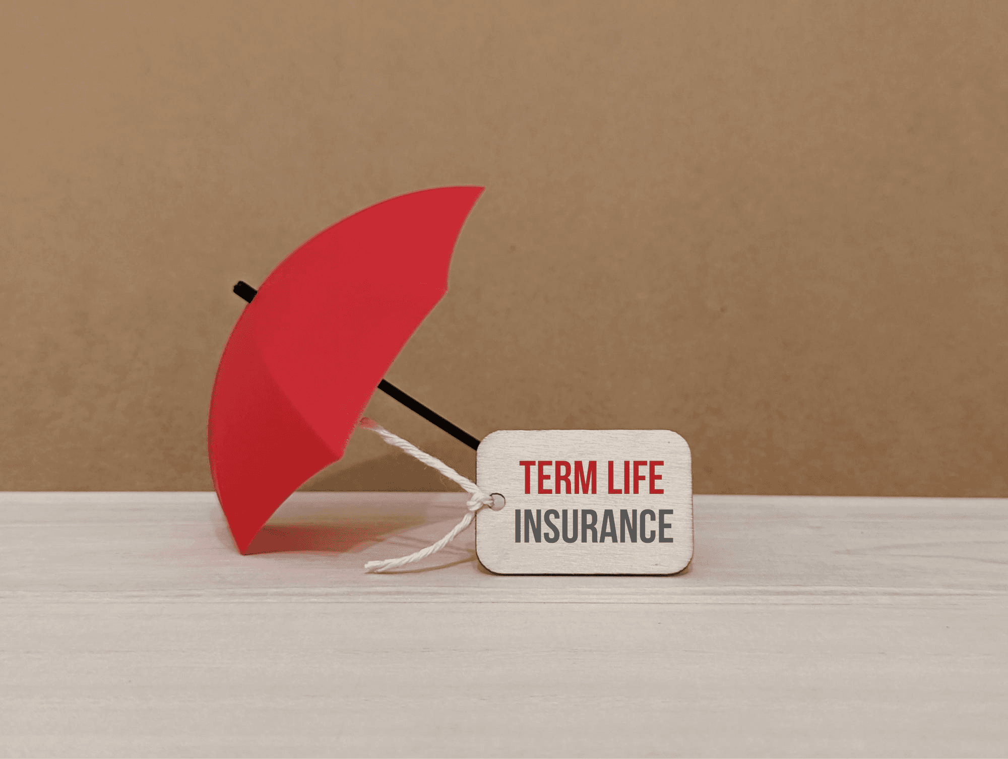 Term life insurance written on a small board.